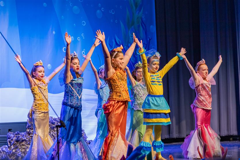 Students perform onstage